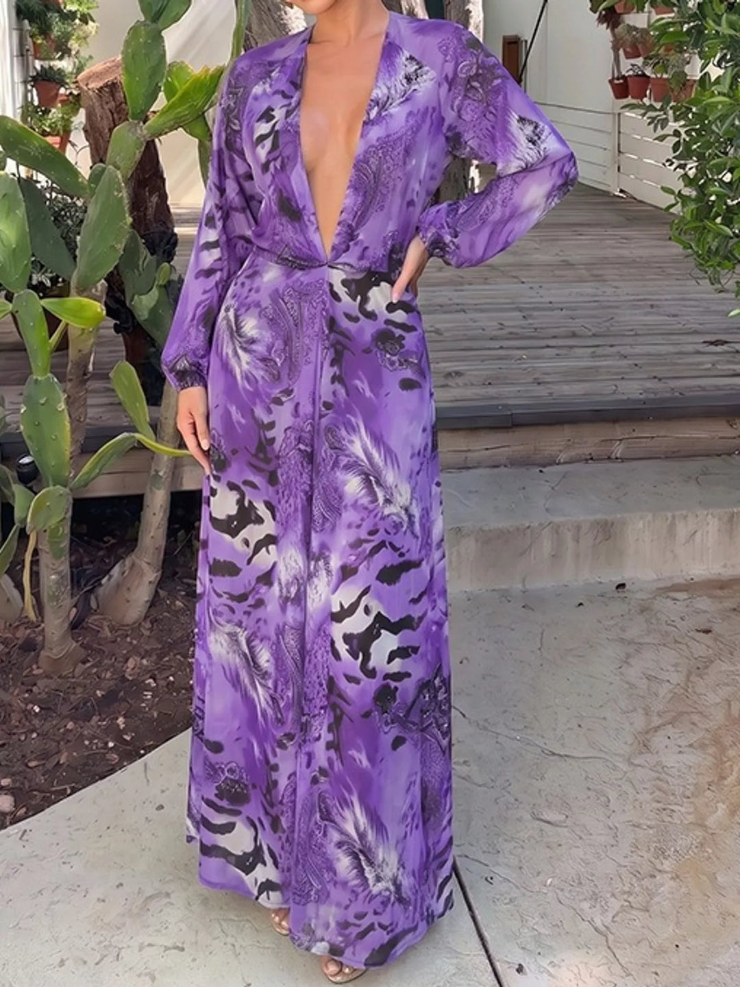 Purple maxi dress worn on a model, showing the long sleeves