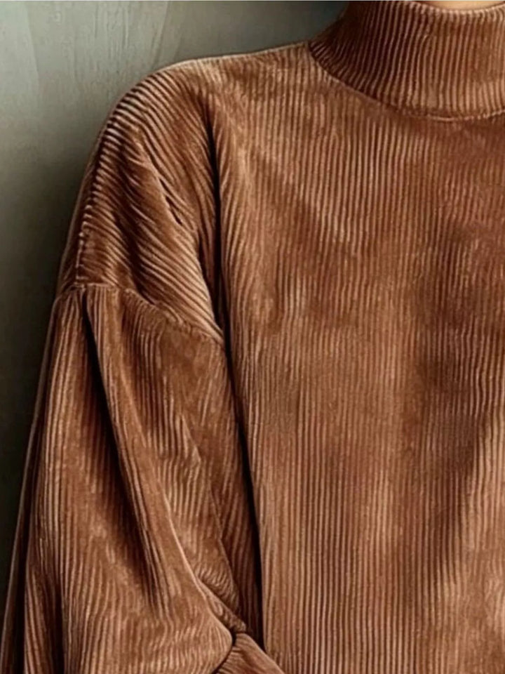 Close-up of the corded texture on the brown mini dress