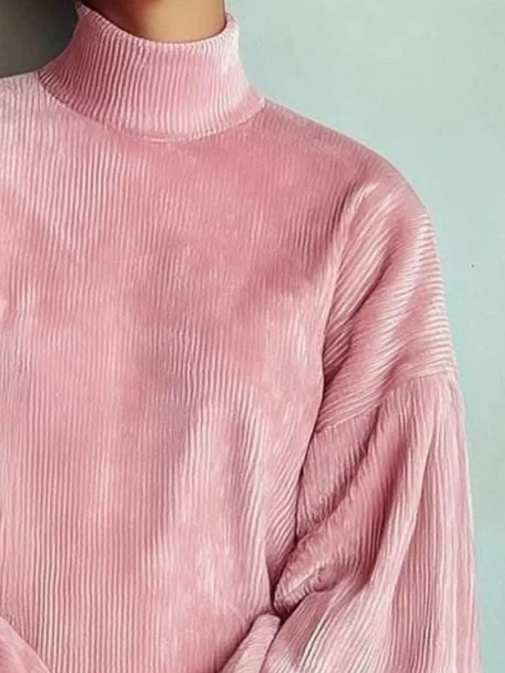 Close-up of the corded texture on the pink mini dress