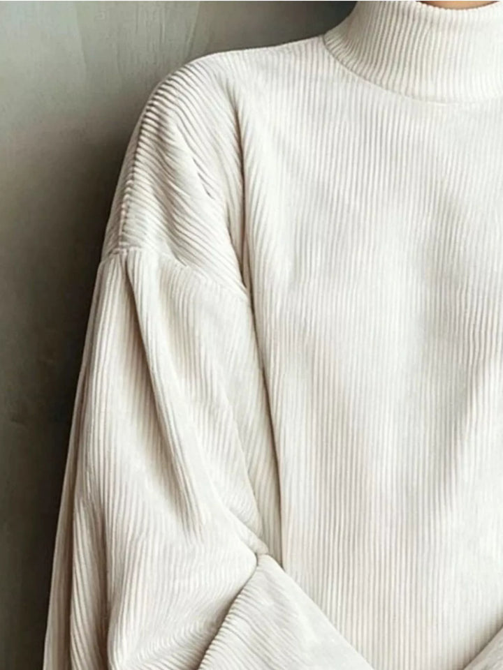 Close-up of the corded texture on the white mini dress