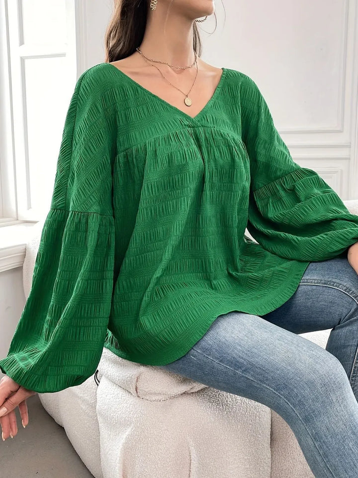 Crinkle texture gathered yoke v-neck in dark green, styled on model 2