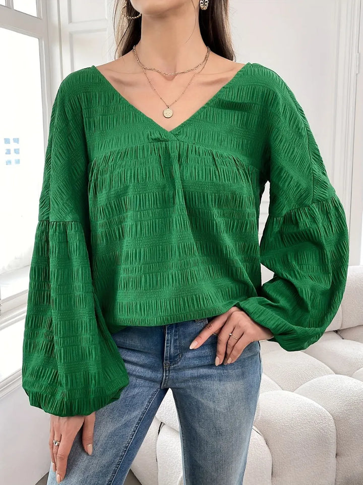 Crinkle texture gathered yoke v-neck in dark green, styled on model