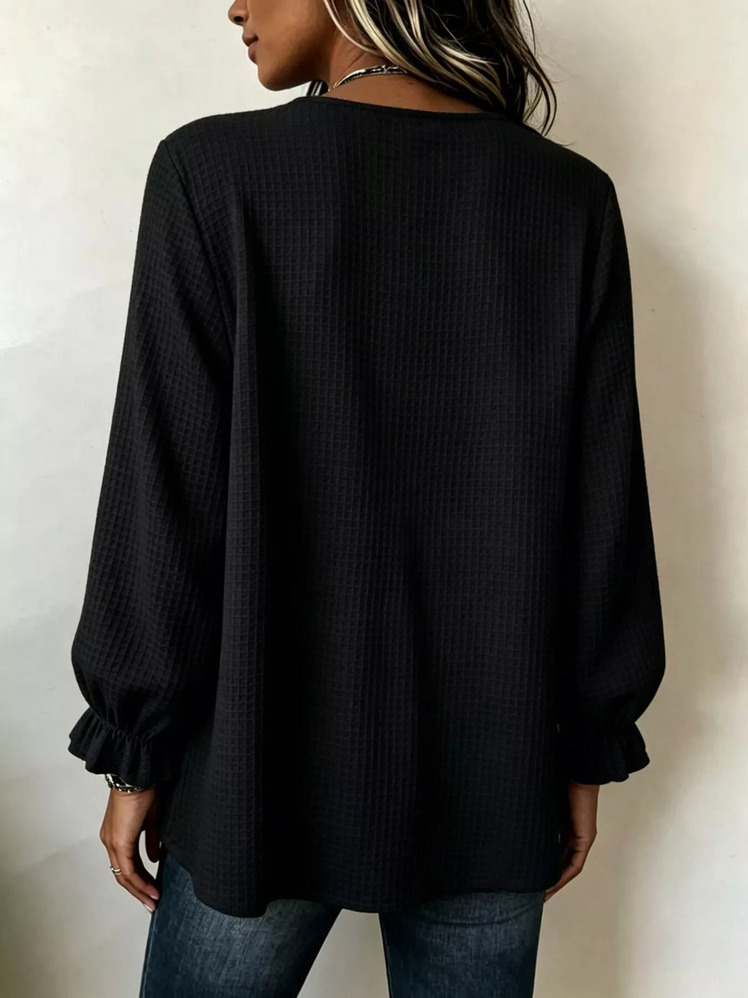 Waffle knit notched v-neck big buttons in black, back view