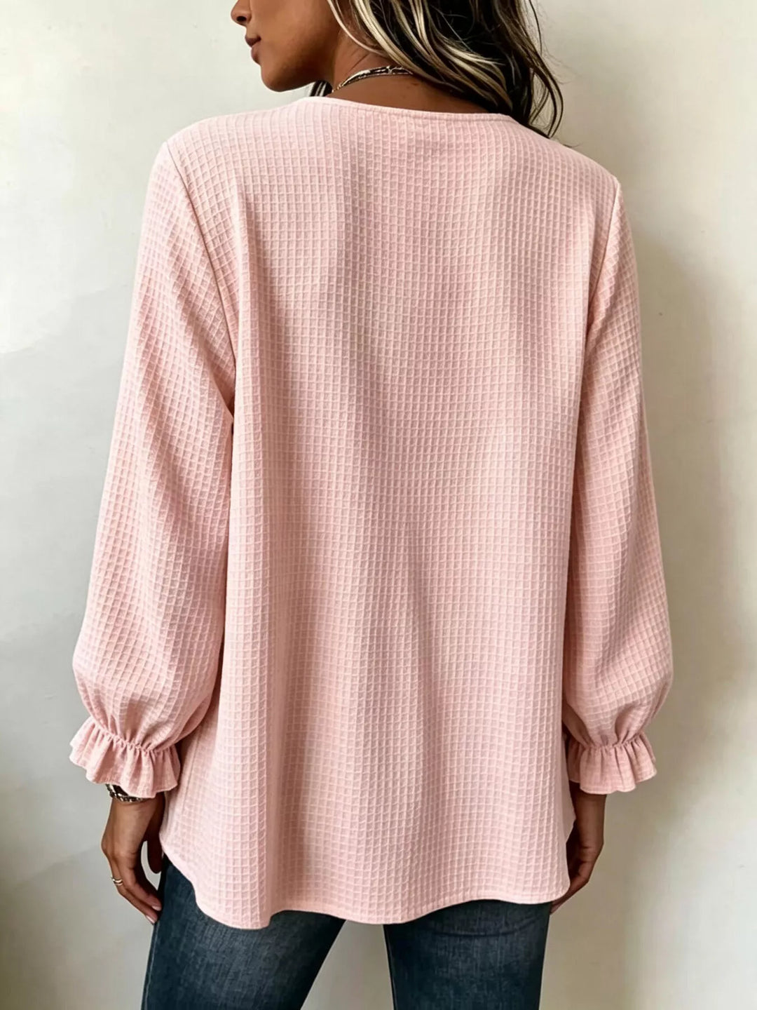 Waffle knit notched v-neck big buttons in blush pink, back view