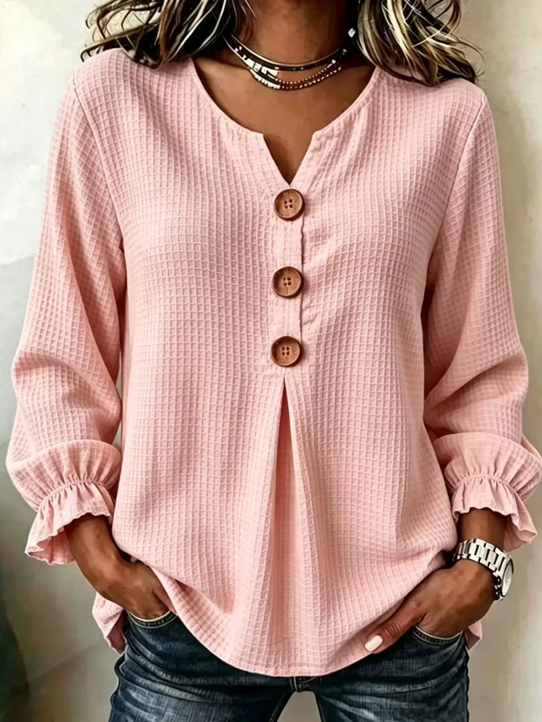 Waffle knit notched v-neck big buttons in blush pink, front view