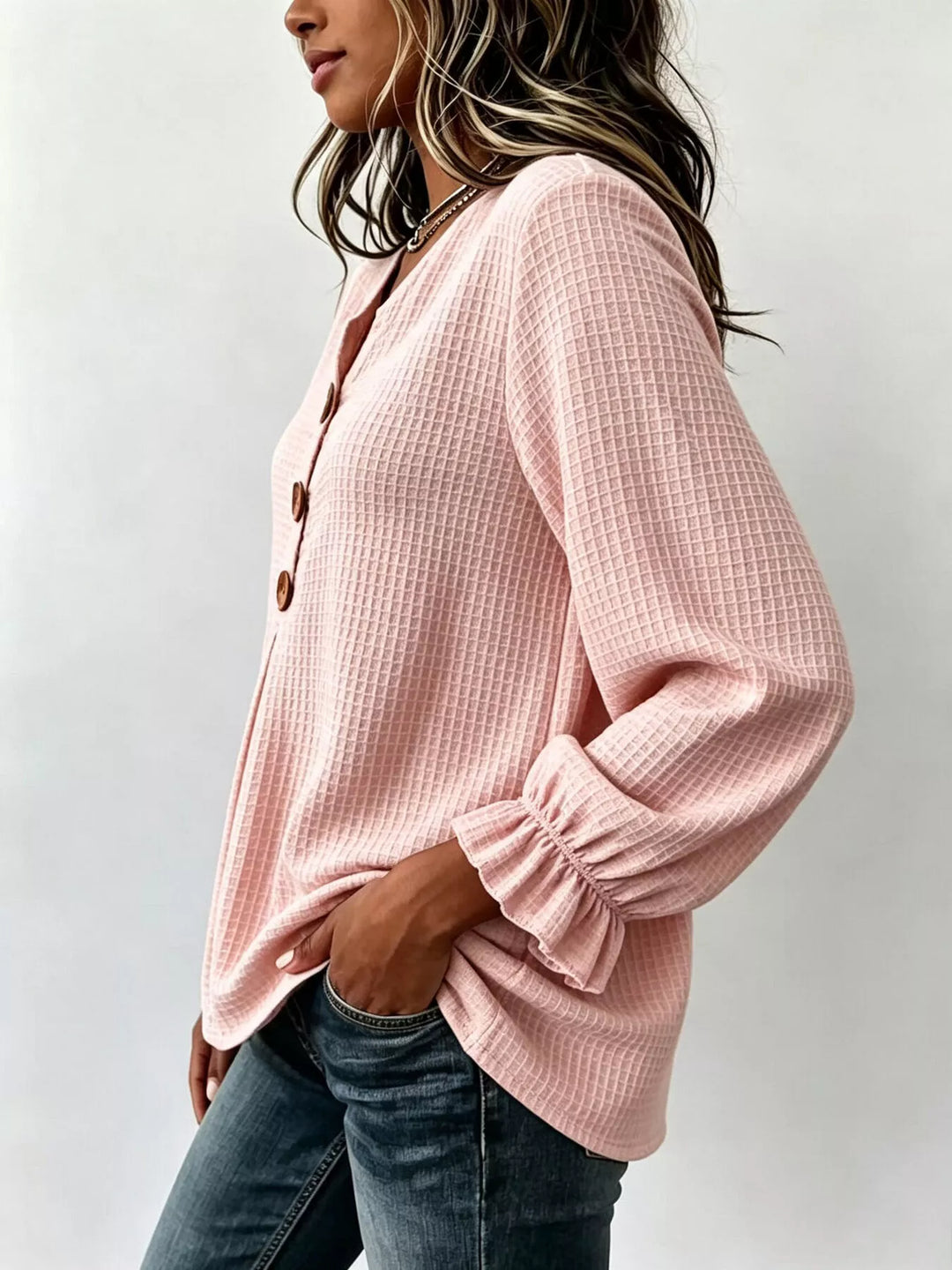 Waffle knit notched v-neck big buttons in blush pink, styled on model 2