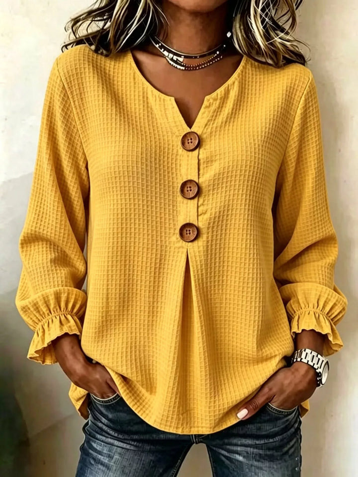 Waffle knit notched v-neck big buttons in mustard, front view