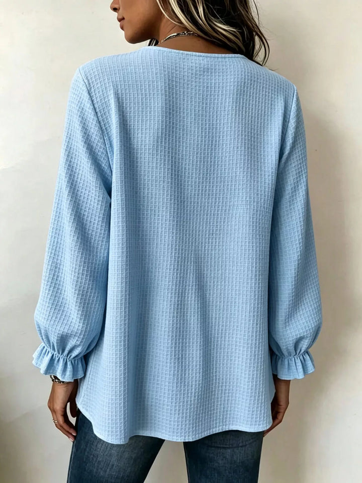 Waffle knit notched v-neck big buttons in pastel blue, back view