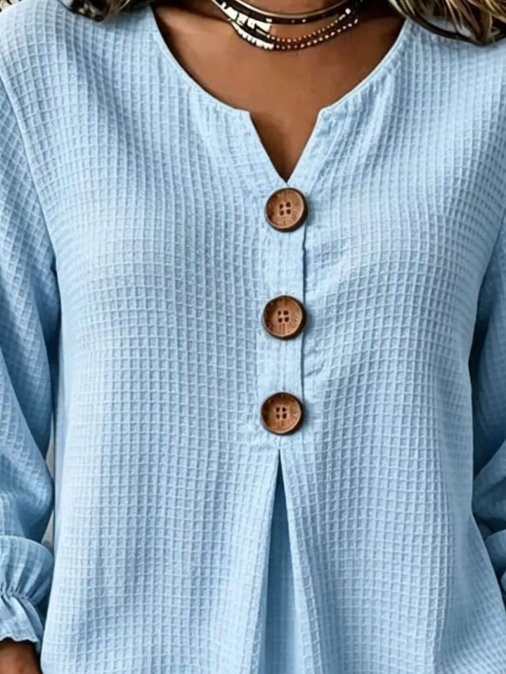 Waffle knit notched v-neck big buttons in pastel blue, close-up detail