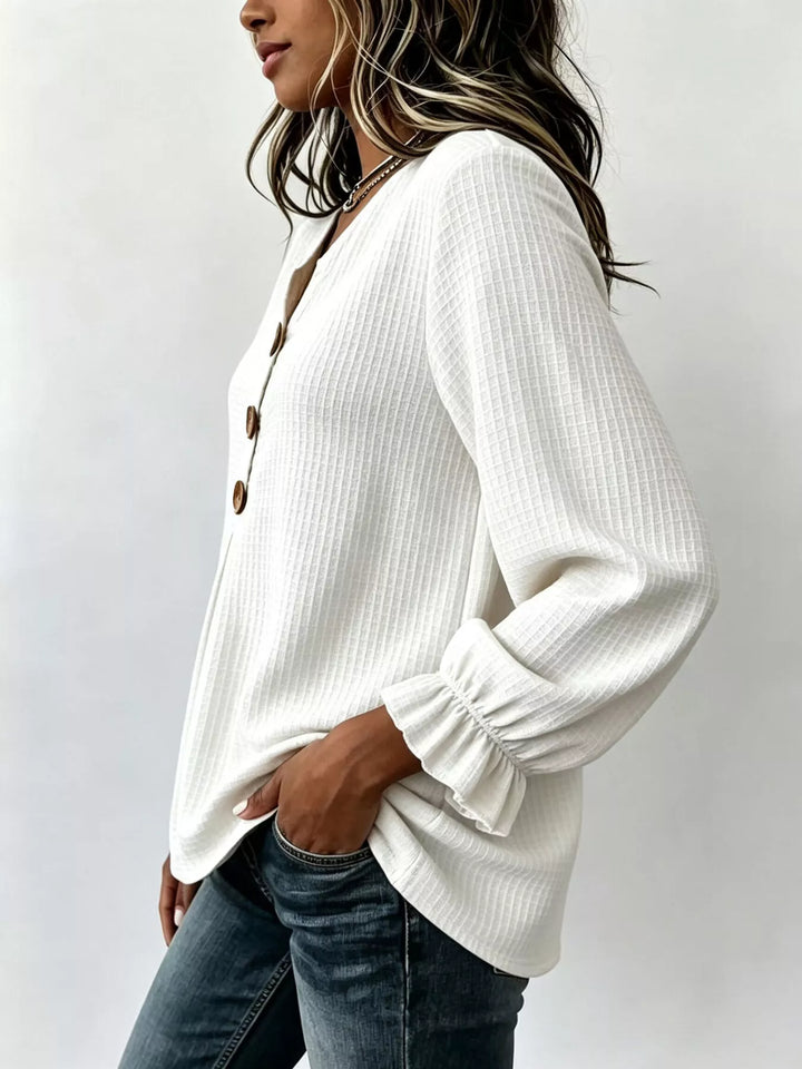 Waffle knit notched v-neck big buttons in white, styled on model
