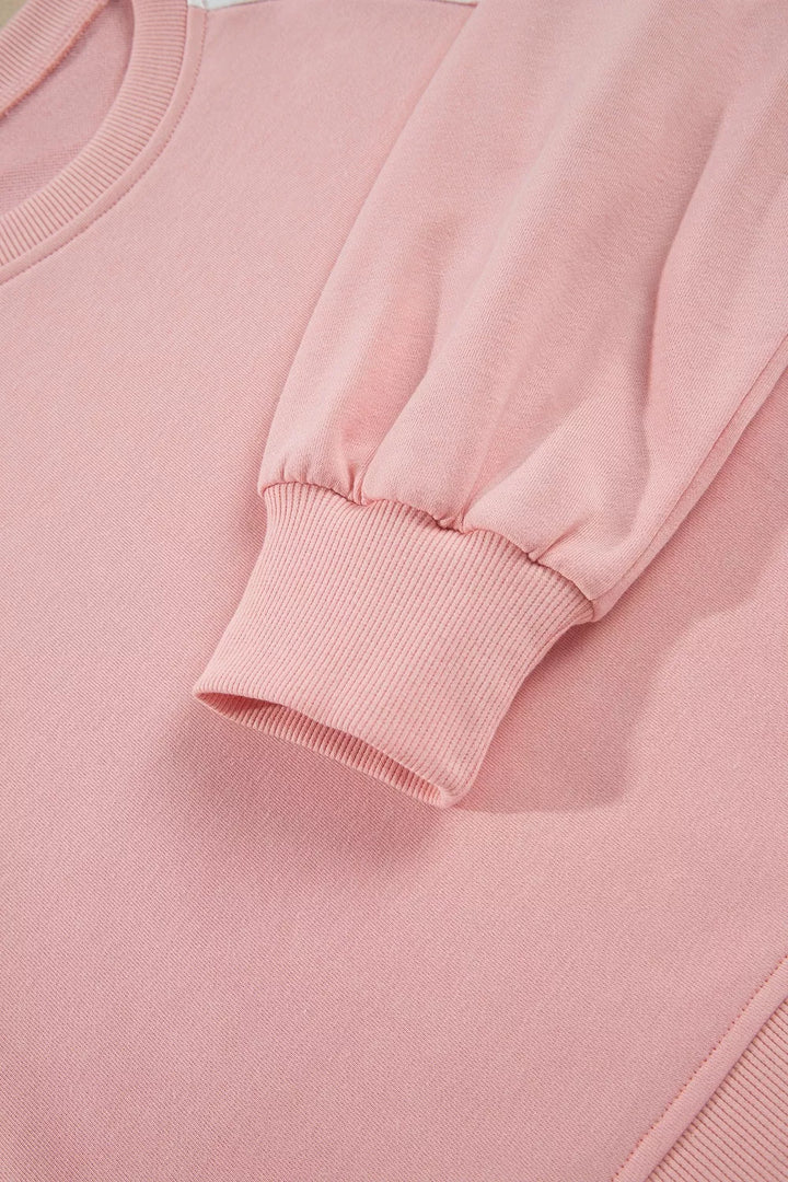 Close-up of the blush sweatshirt ribbed cuff and sleeve