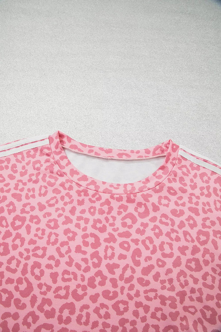 Close-up of pink leopard print lounge top neckline with white side stripe