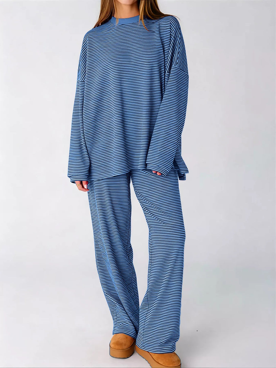 Blue lounge set with oversized side slit top and wide leg pants, front view
