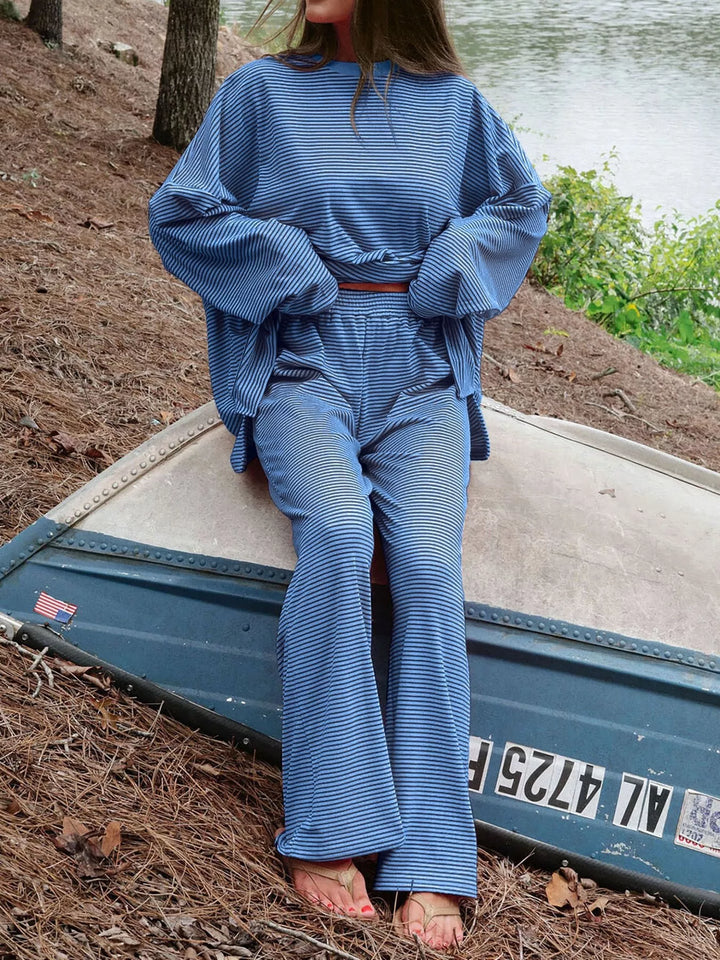 Blue lounge set worn seated on a boat, relaxed pose