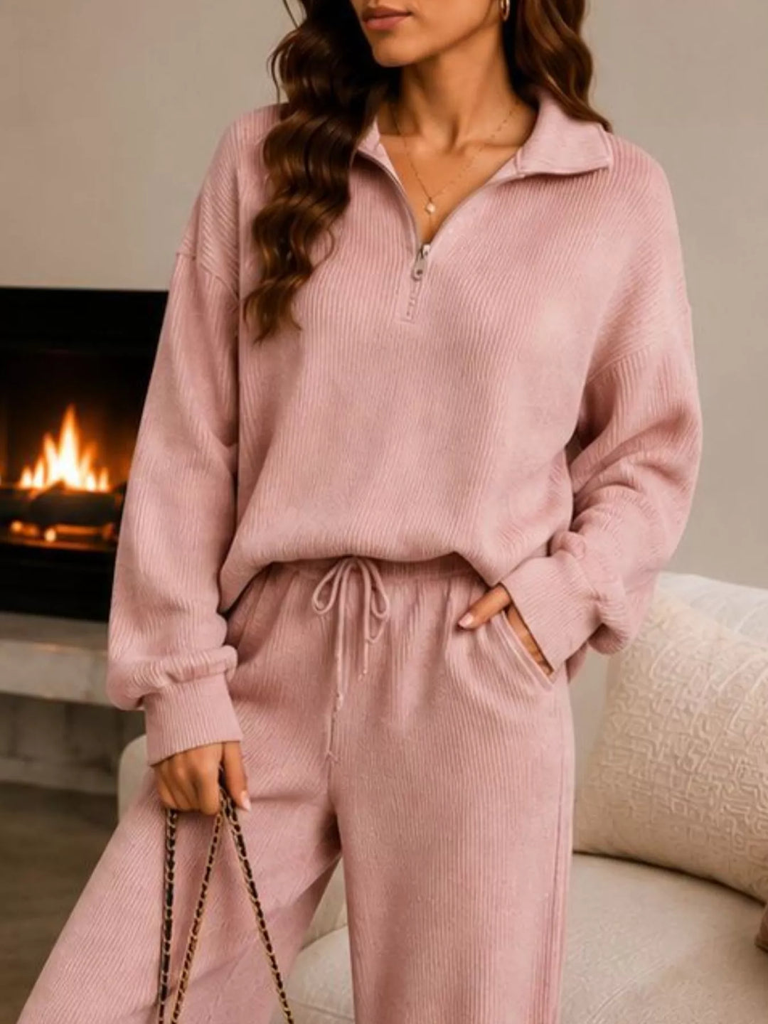 Dusty pink ribbed knit quarter zip top and pants, close view