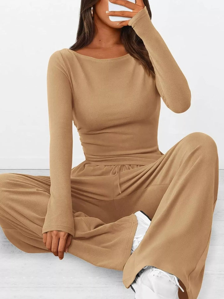 Camel ribbed lounge set, seated on the floor with legs crossed