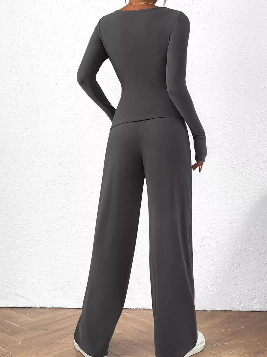 Charcoal ruched long sleeve top and wide leg pants from behind