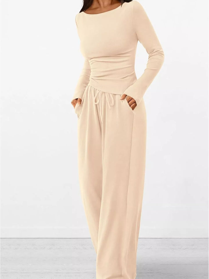 Cream lounge set from a three-quarter angle with hand in pocket