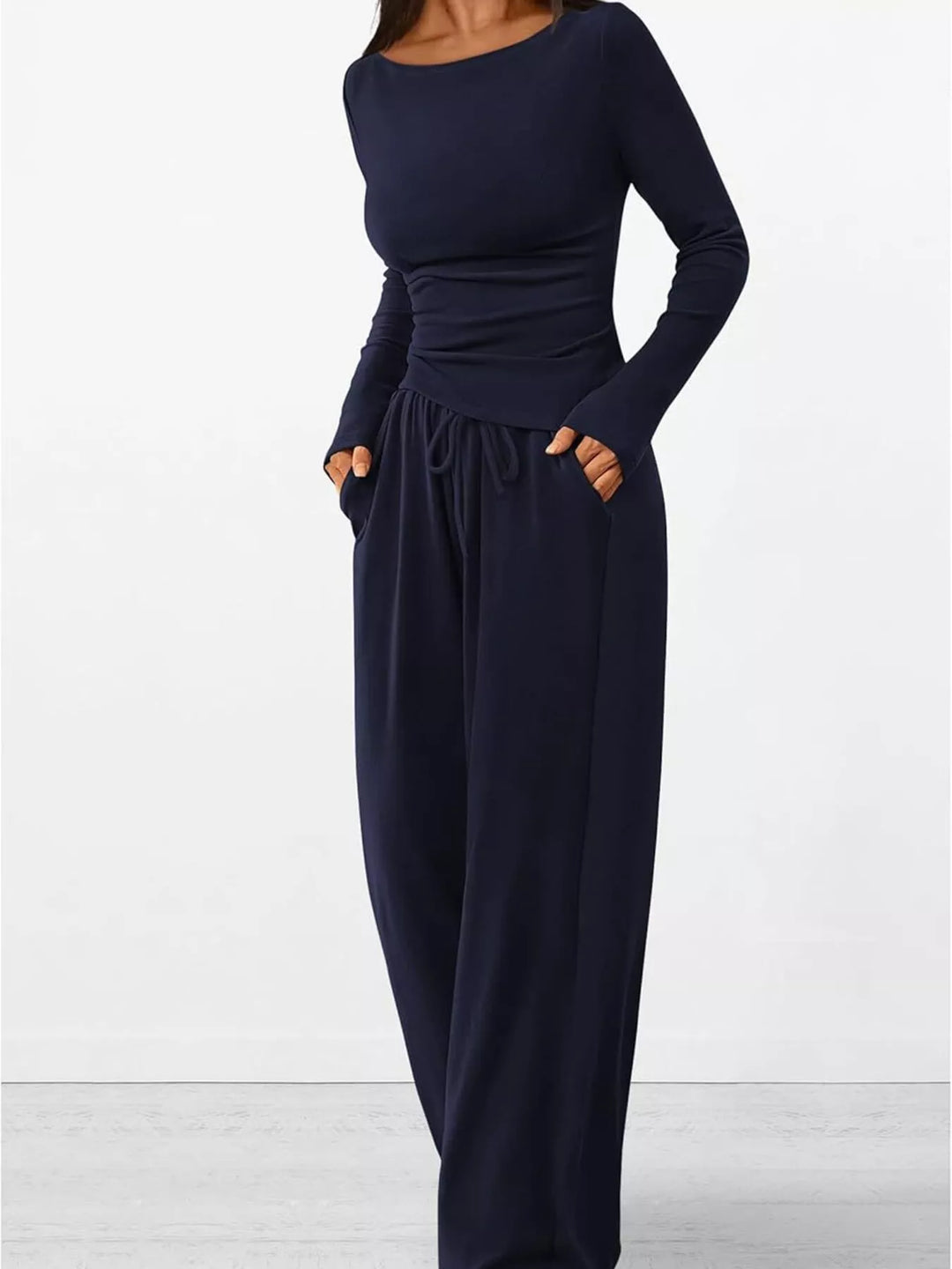 Navy lounge set with hand in pocket and drawstring waist visible