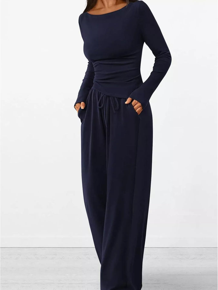 Navy lounge set with hand in pocket and drawstring waist visible