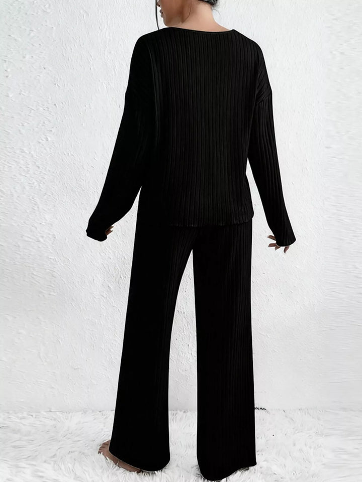 Back view of the black ribbed v neck top and wide leg pants