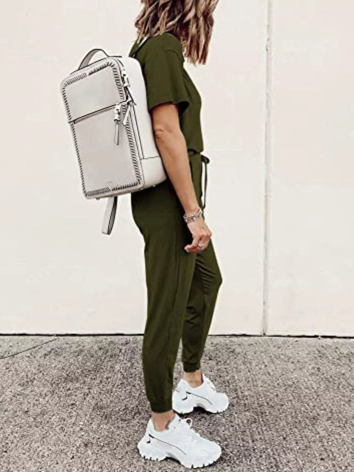 Army green short sleeve tee and jogger pants, side view with a backpack