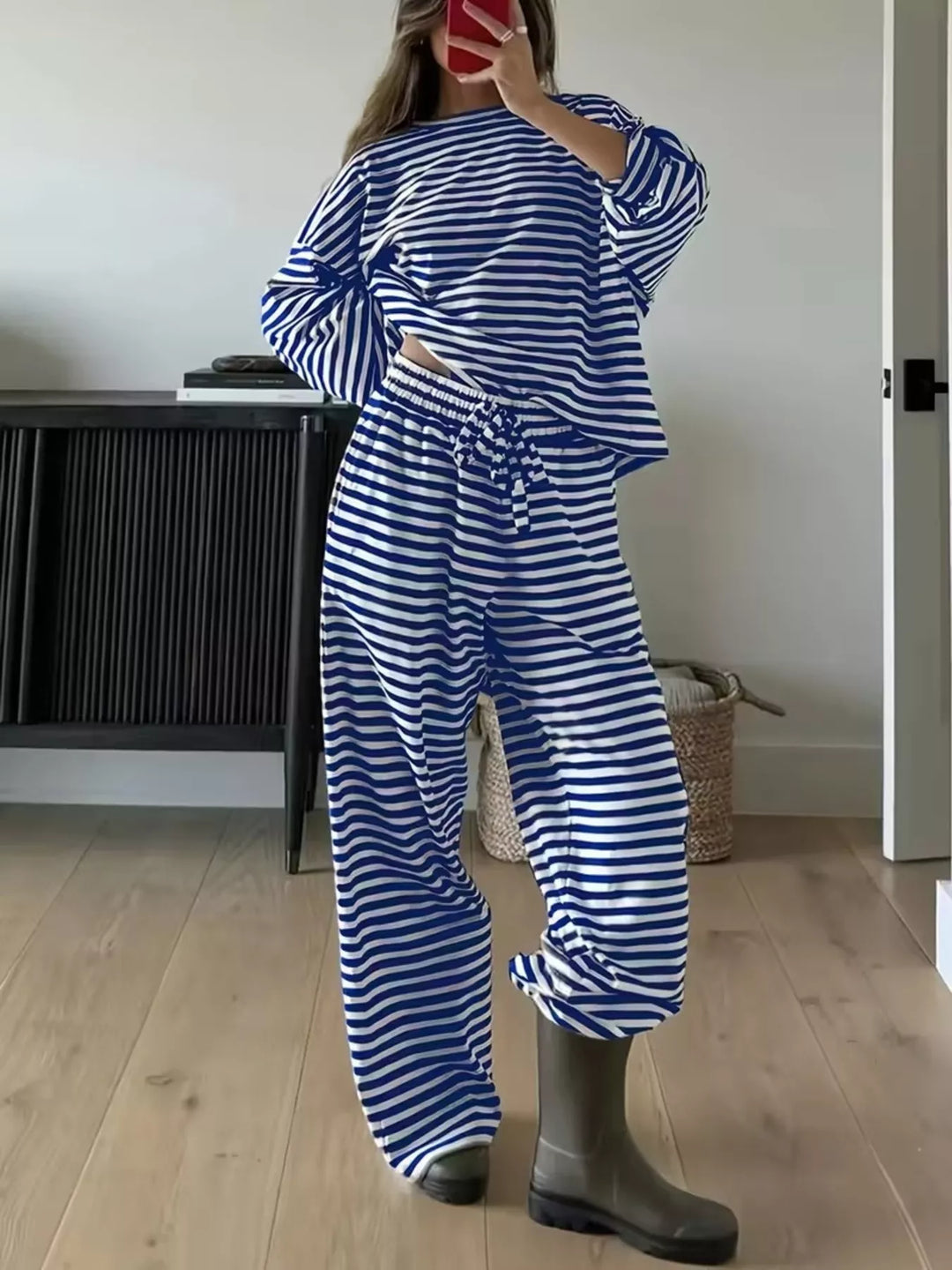 Navy striped lounge set worn with boots, full length mirror view