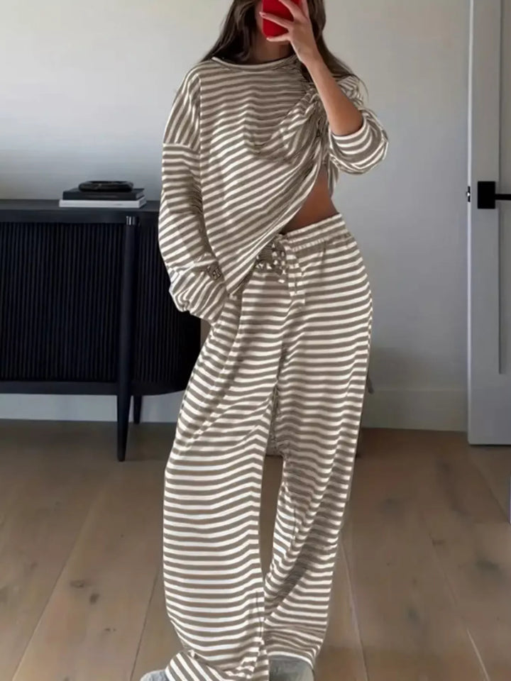 Full length view of the taupe striped lounge set in a mirror