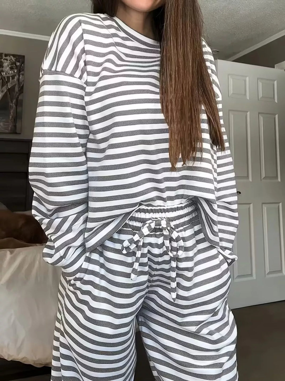 Gray striped lounge set with oversized top and drawstring wide leg pants, front view