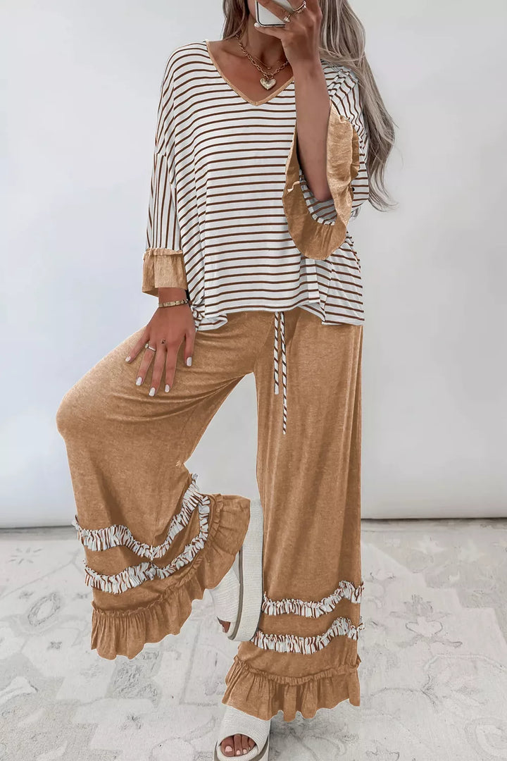 Women's camel lounge set with striped V neck top and wide leg pants on model