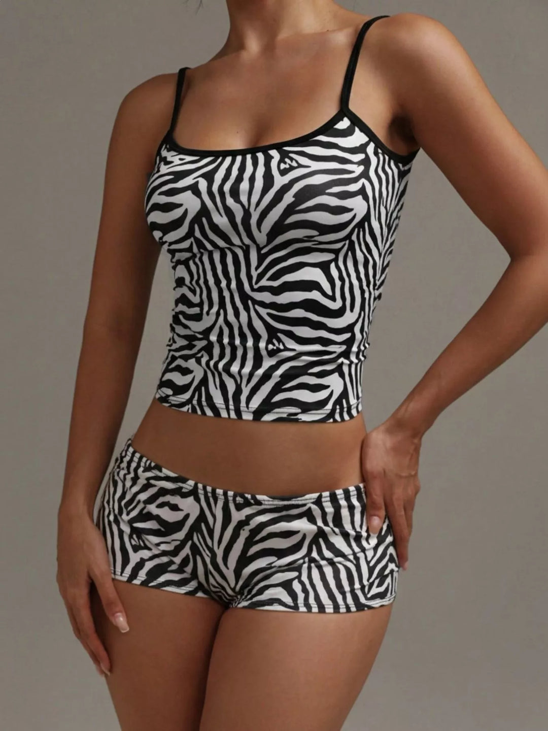 Zebra print satin-look cami and shorts matching set, hand on hip