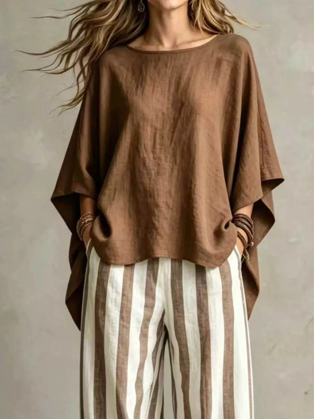 Brown matching set top with draped batwing sleeves, closer front view