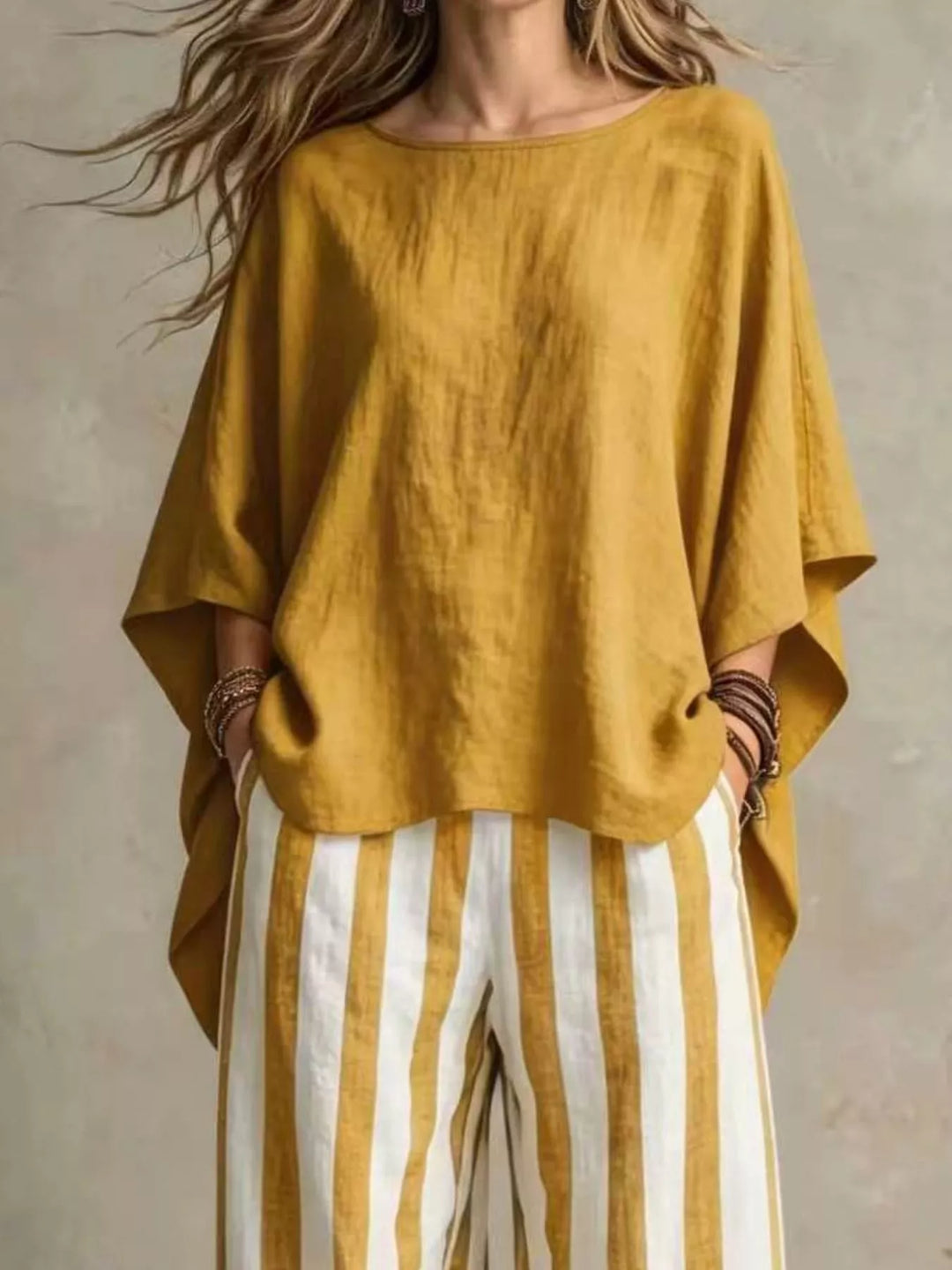 Mustard matching set with batwing sleeves and striped pants, closer view