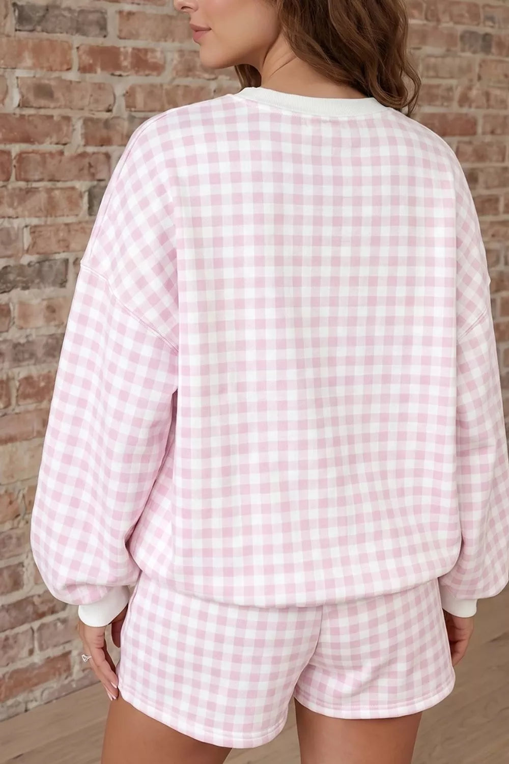 Back view of the blush pink gingham sweatshirt and shorts set