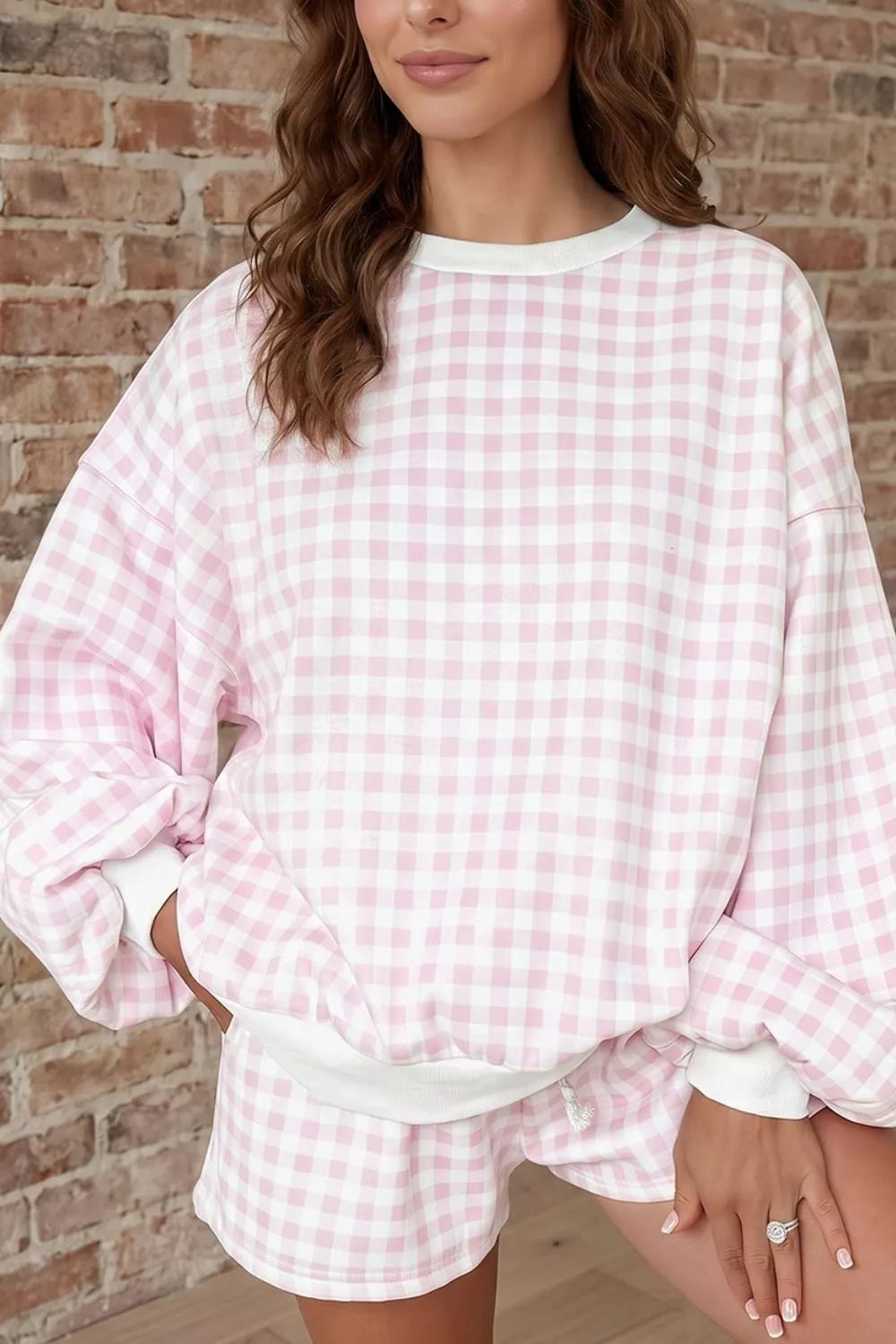 Women's matching set in blush pink gingham, sweatshirt and drawstring shorts, on-model torso view