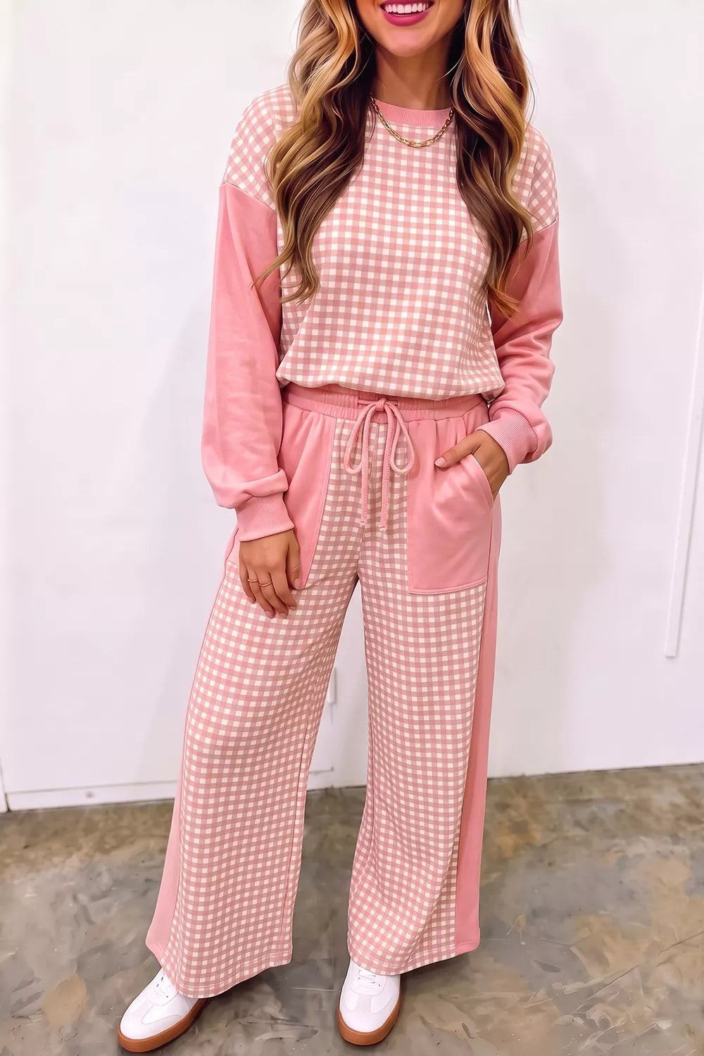 Women's coral pink gingham matching set with sweatshirt and wide leg pants, front view
