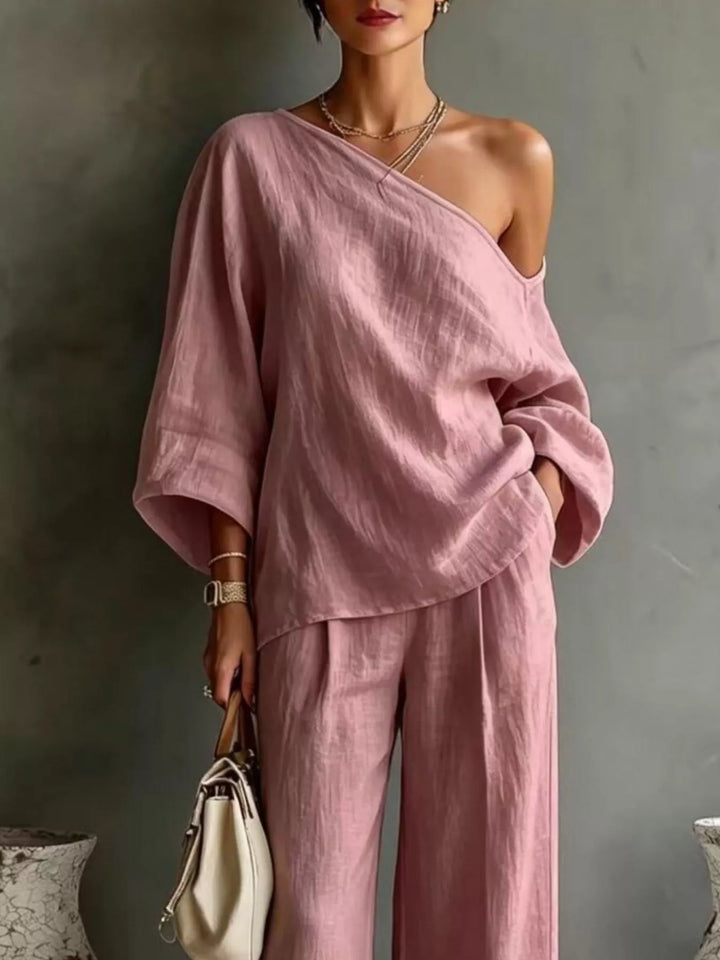 Close-up of the dusty pink one shoulder top with batwing sleeves