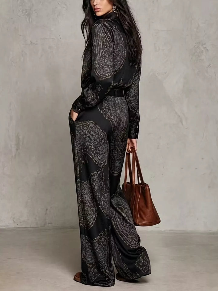 Side view of the black paisley shirt and wide leg pants set