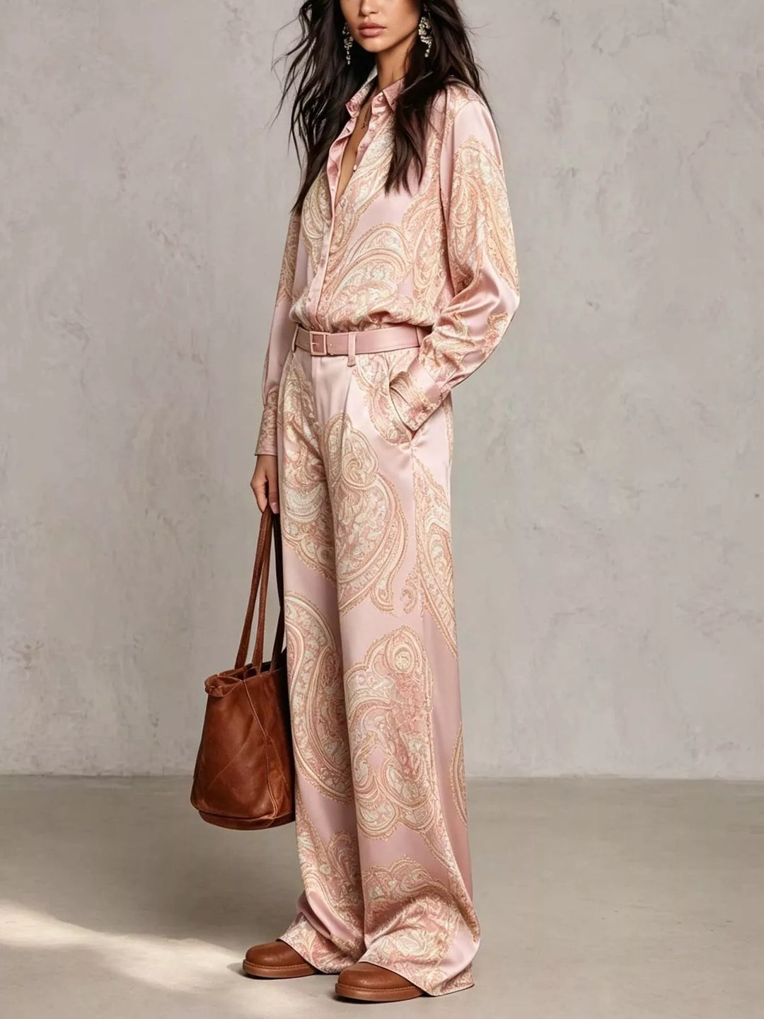 Blush pink paisley shirt and wide leg pants with a brown tote bag