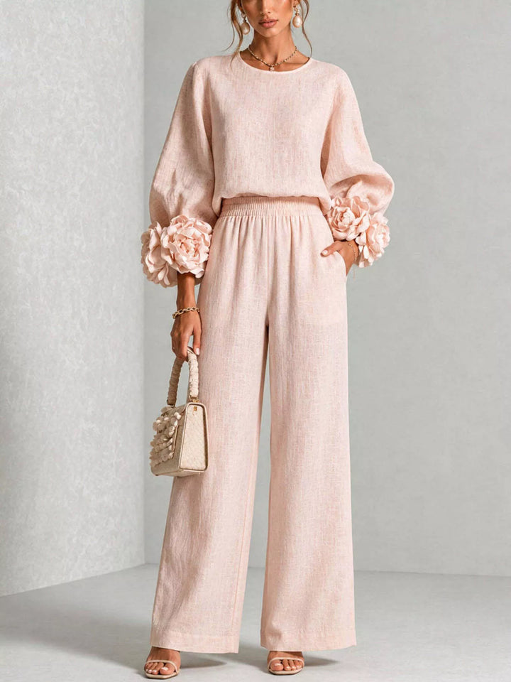 Women's matching set in blush pink, puff sleeve top with rose cuffs and wide leg pants