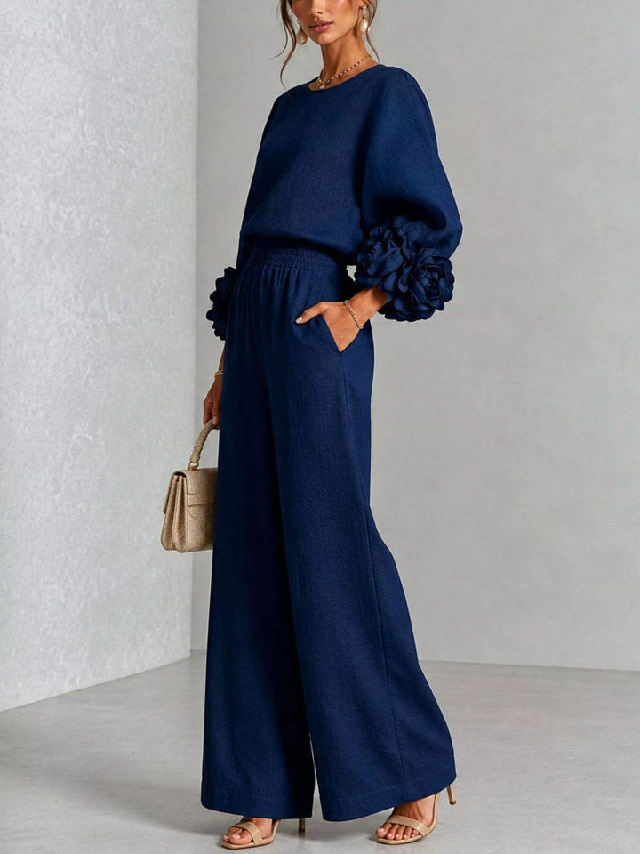 Side view of the navy matching set with a hand in the pocket