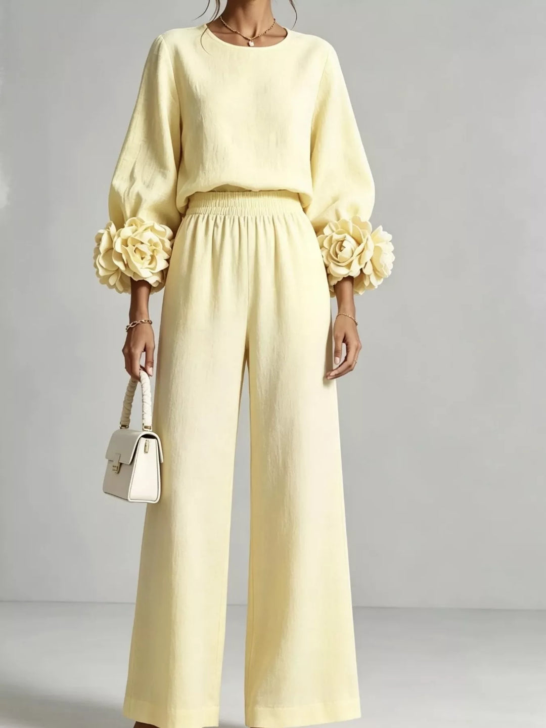 Pastel yellow matching set with rose cuff puff sleeves and wide leg pants