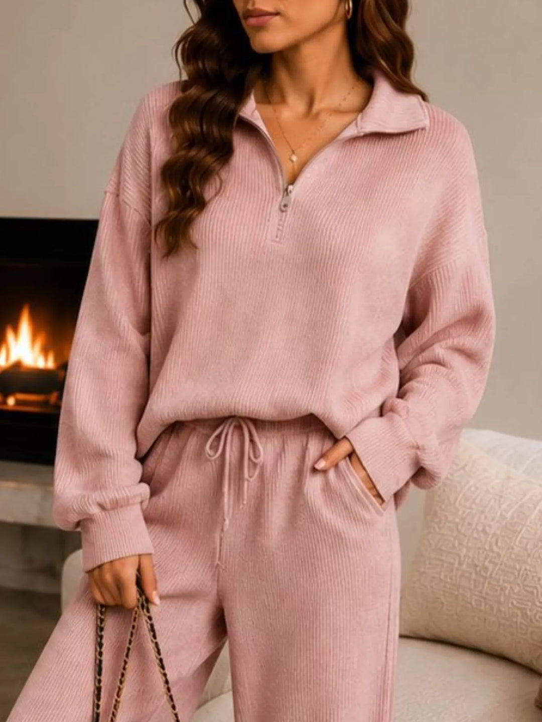 Close-up of the dusty pink half zip pullover with a drawstring waist