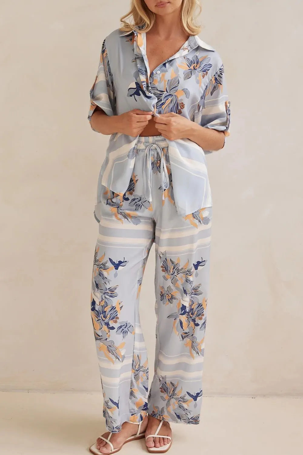Light blue floral matching set standing front view with hands in pockets
