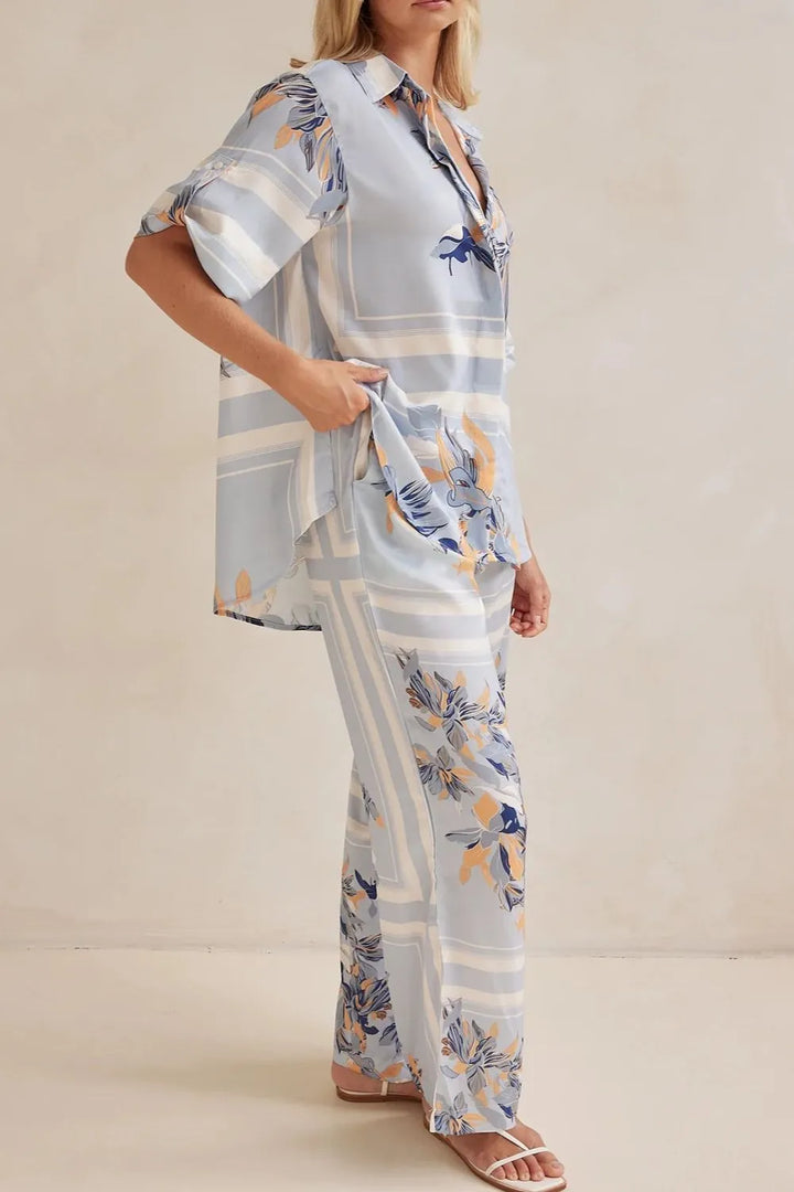 Side angle of the light blue floral shirt and pants set
