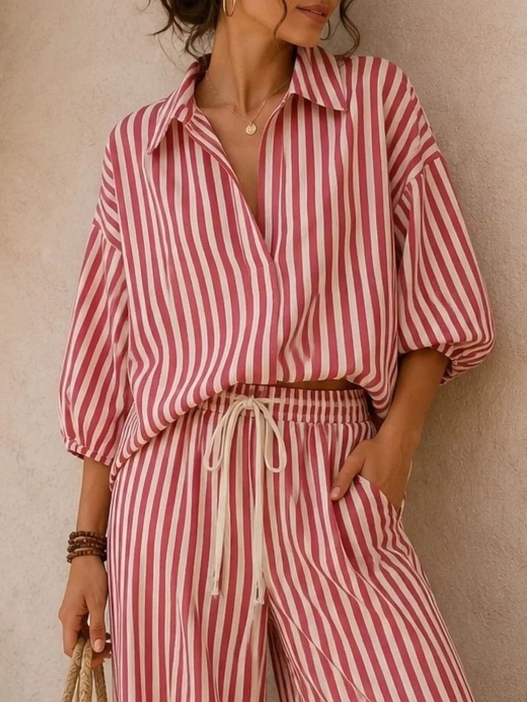 Rose stripe collared shirt with puff sleeves and drawstring waist pants, close view