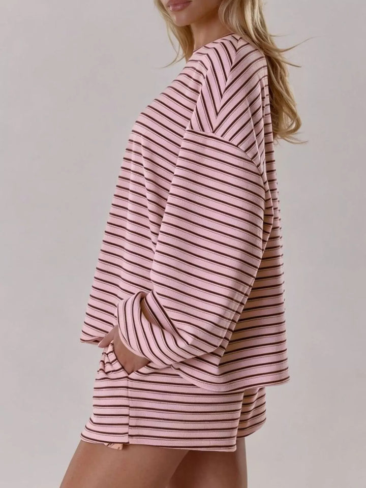 Striped long sleeve top and drawstring shorts in pink, styled on model 2