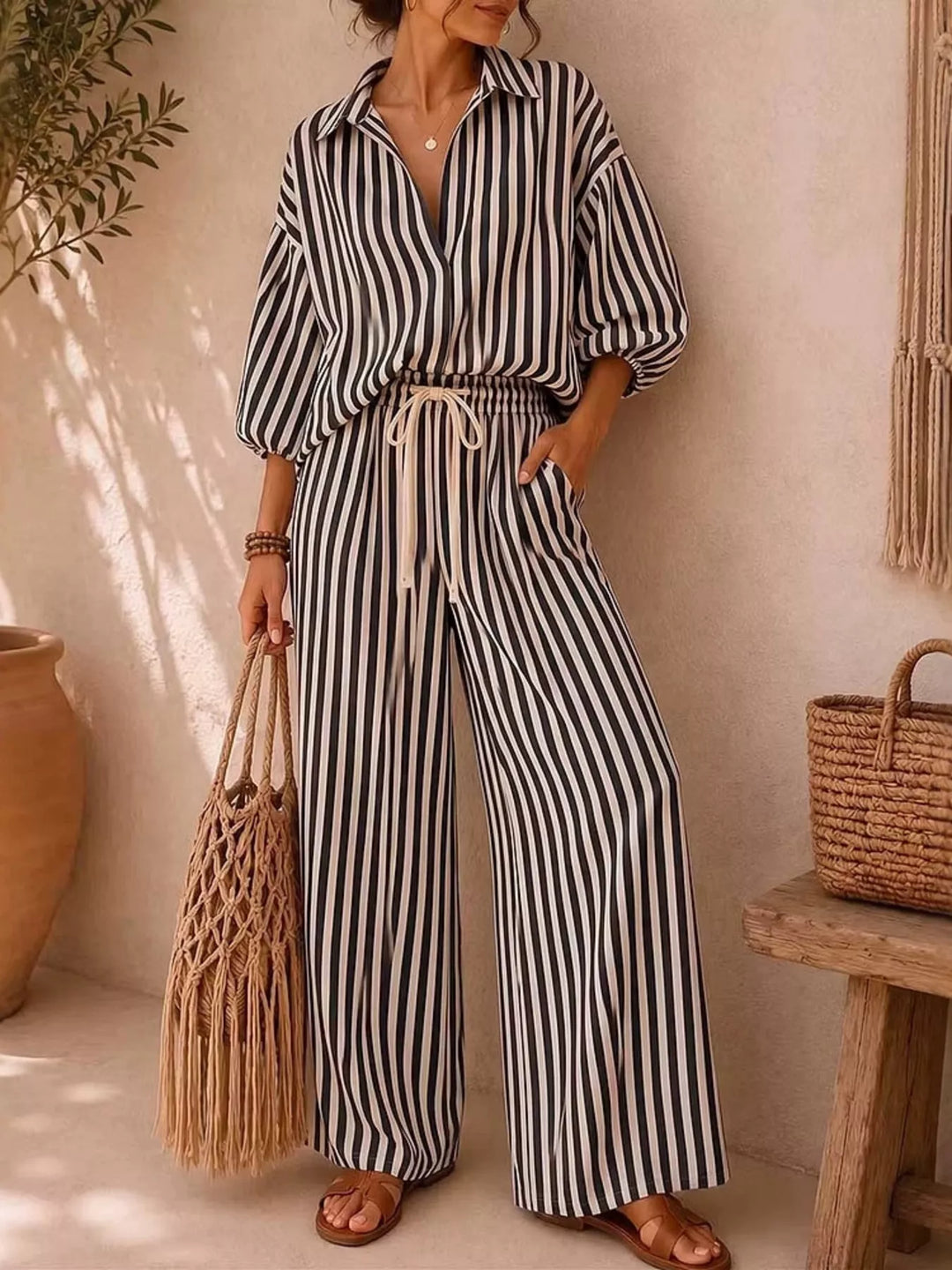 Black striped matching set with collared shirt and wide leg pants, full view
