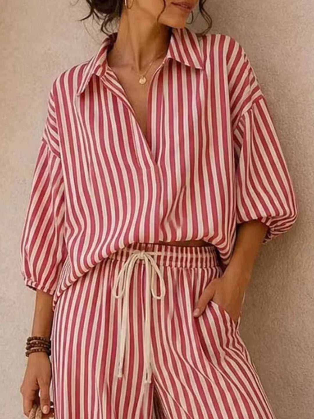 Close-up of the rose red striped shirt with relaxed sleeves