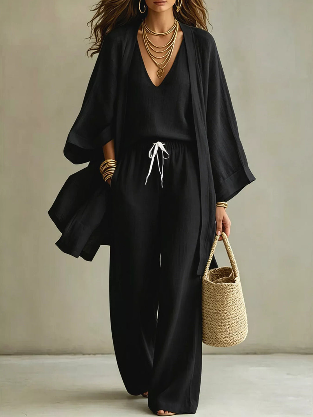 Three piece v neck top, cardigan and pants in black, front view